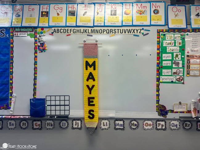 pencil crochet wall hanging in classroom