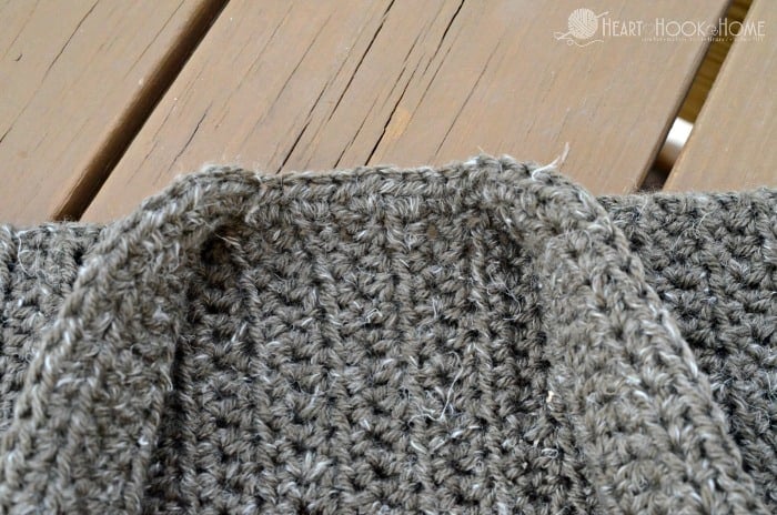 Grey example of the 2/3 T size of the Cozy Classroom Cardigan crochet pattern.