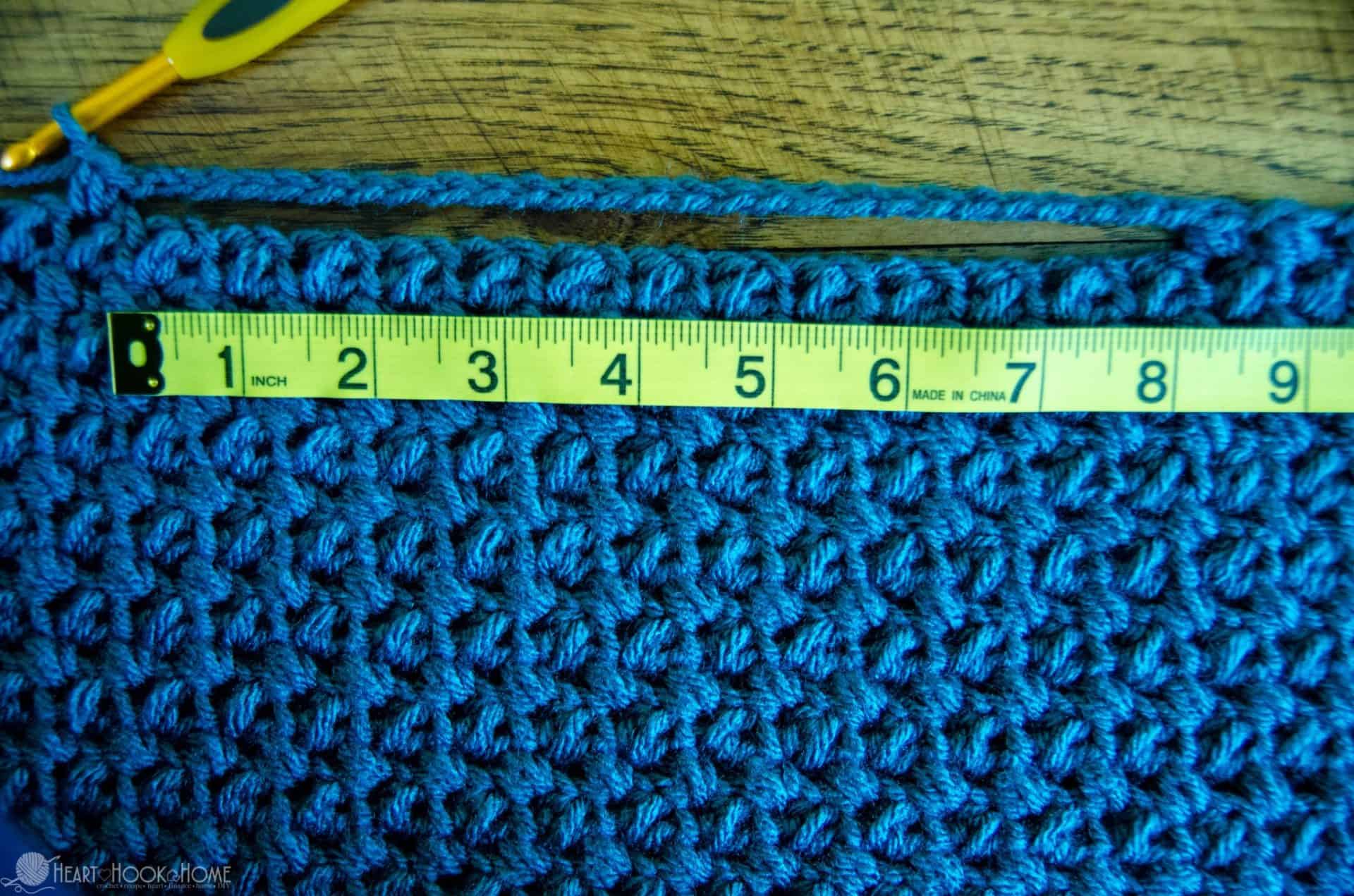 measure tape measuring out crochet stitches
