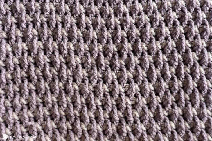 Sample of the Alpine Baby Blanket crochet pattern in a gray colorway.