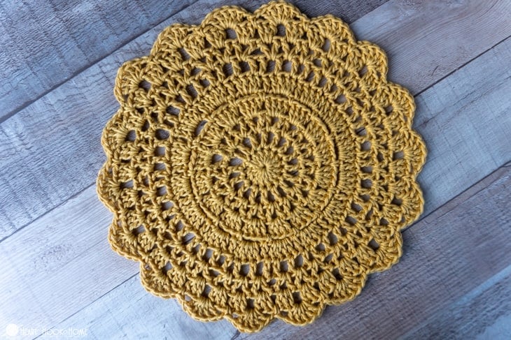 Sample of the Outdoor Table Mat crochet pattern in a gold colorway.