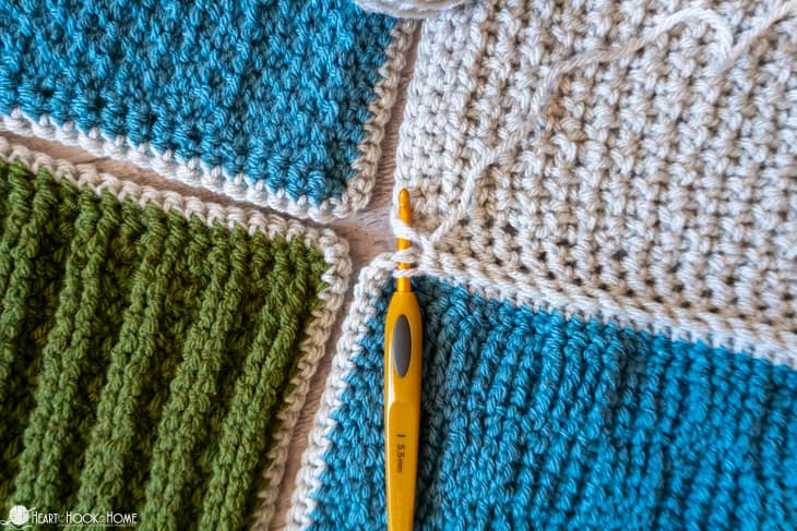 In progress example of the Slip stitch method of joining crocheted squares together.