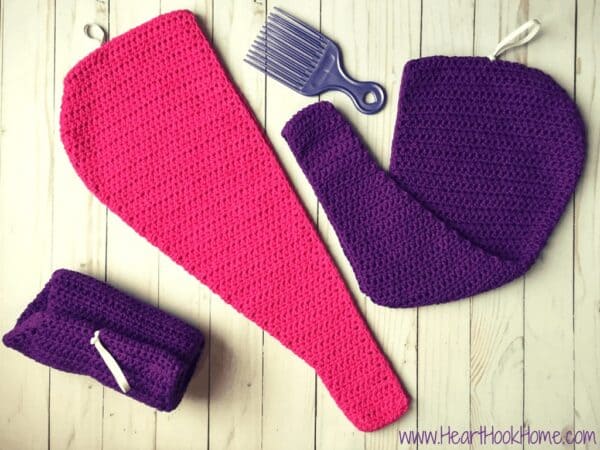 Hair Towel with a Twist crochet pattern in pink and purple colorways.