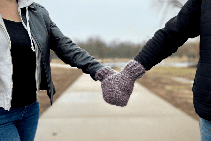 Example of conjoined mitten on two hands.