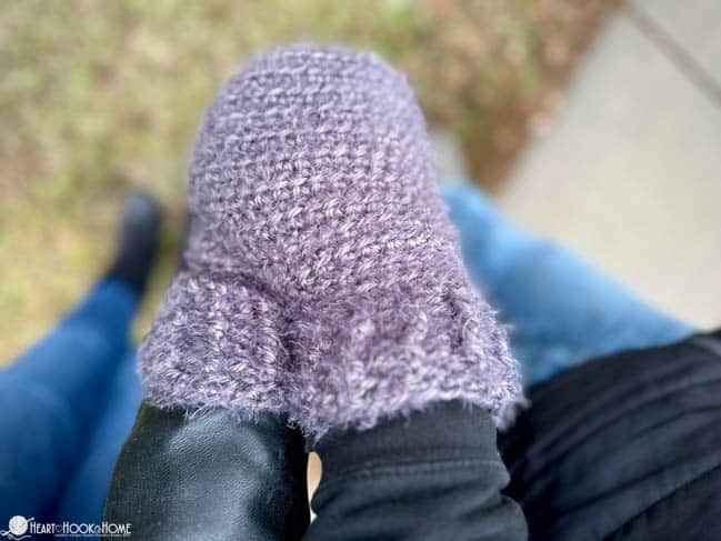 Example of conjoined mitten on two hands.