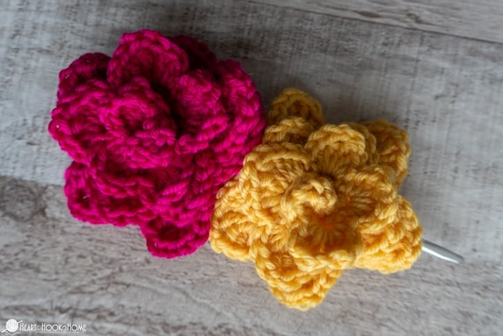 Pink and Yellow flower versions of the Dog Collar Embellishment crochet pattern. 