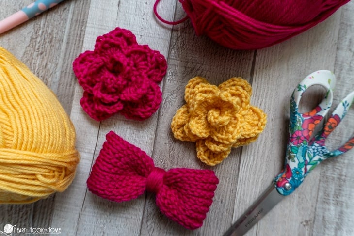 Pink and yellow colorways of the Dog Collar Embellishment crochet pattern in the flower and bow tie versions. 