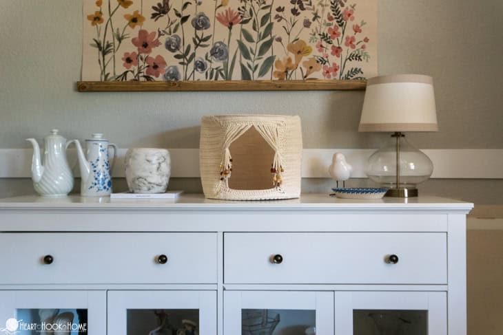 Crochet Cat Cave with beads in neutral colors on a shelf.