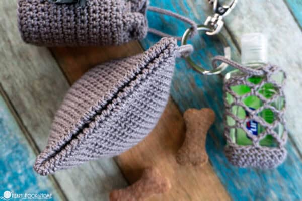 Gray colorway of a closed shut example of the Dog Treat Bag crochet pattern.