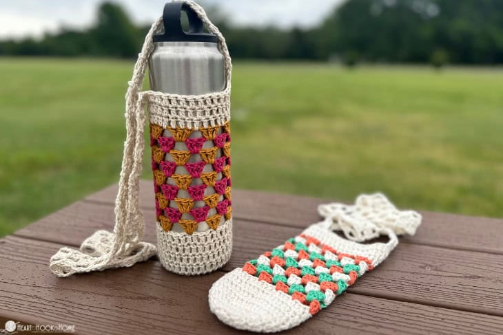 crochet granny stitch water bottle cozy on park bench