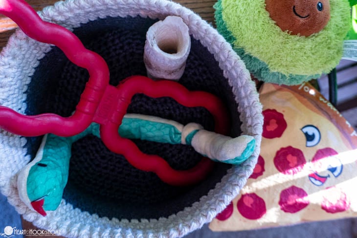 dog toys in crochet basket