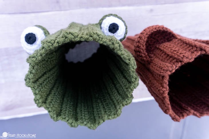 Green frog and brown bear version examples of the Dog Snood crochet pattern.
