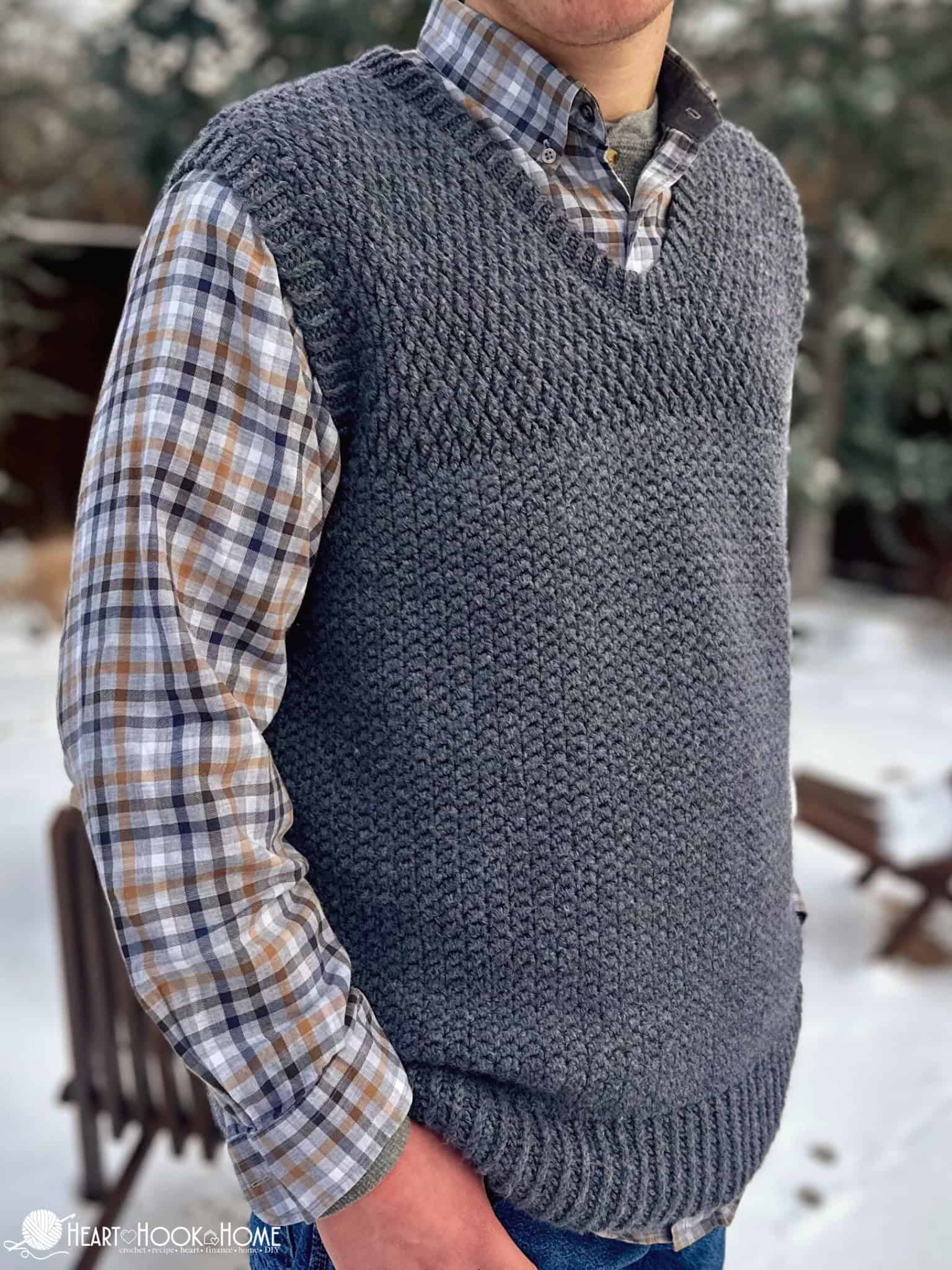 gray sweater vest in snowy backdrop