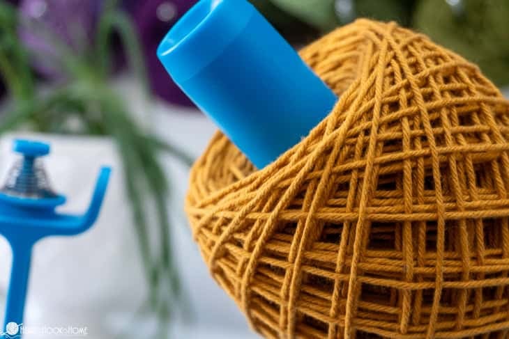 gold yarn on blue electric yarn winder