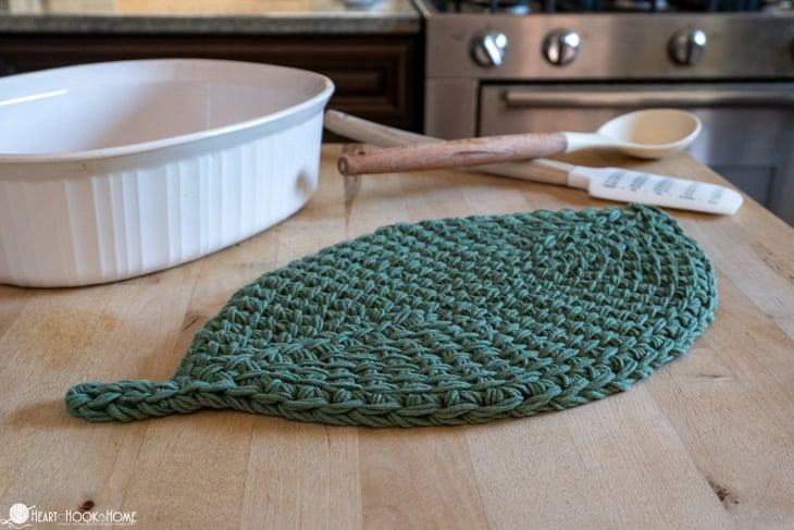green crochet trivet