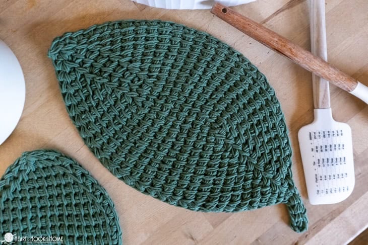 green crocheted leaf shaped hot pad