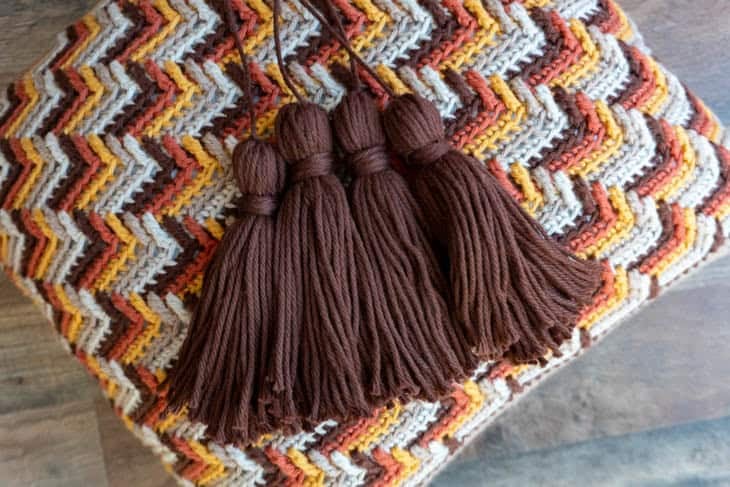Brown tassels on apache tears crochet pillow pattern