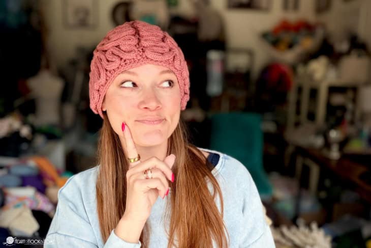 woman wearing crocheted brain beanie