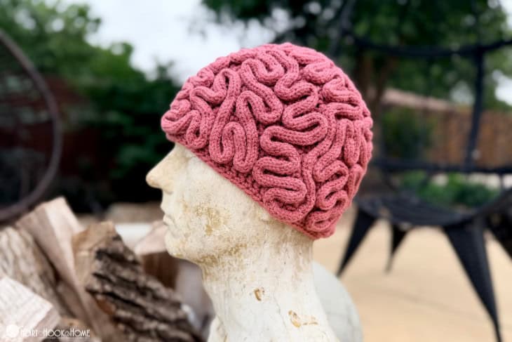 mannequin wearing a crocheted brain beanie