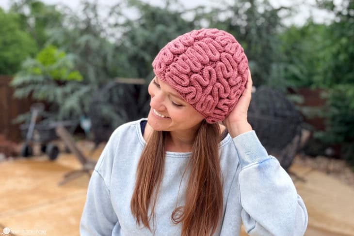 crocheted brain beanie on woman